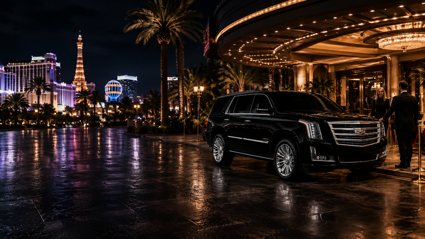 Black Cadillac Escalade under the porte-cochère lighting of a Las Vegas resort at night