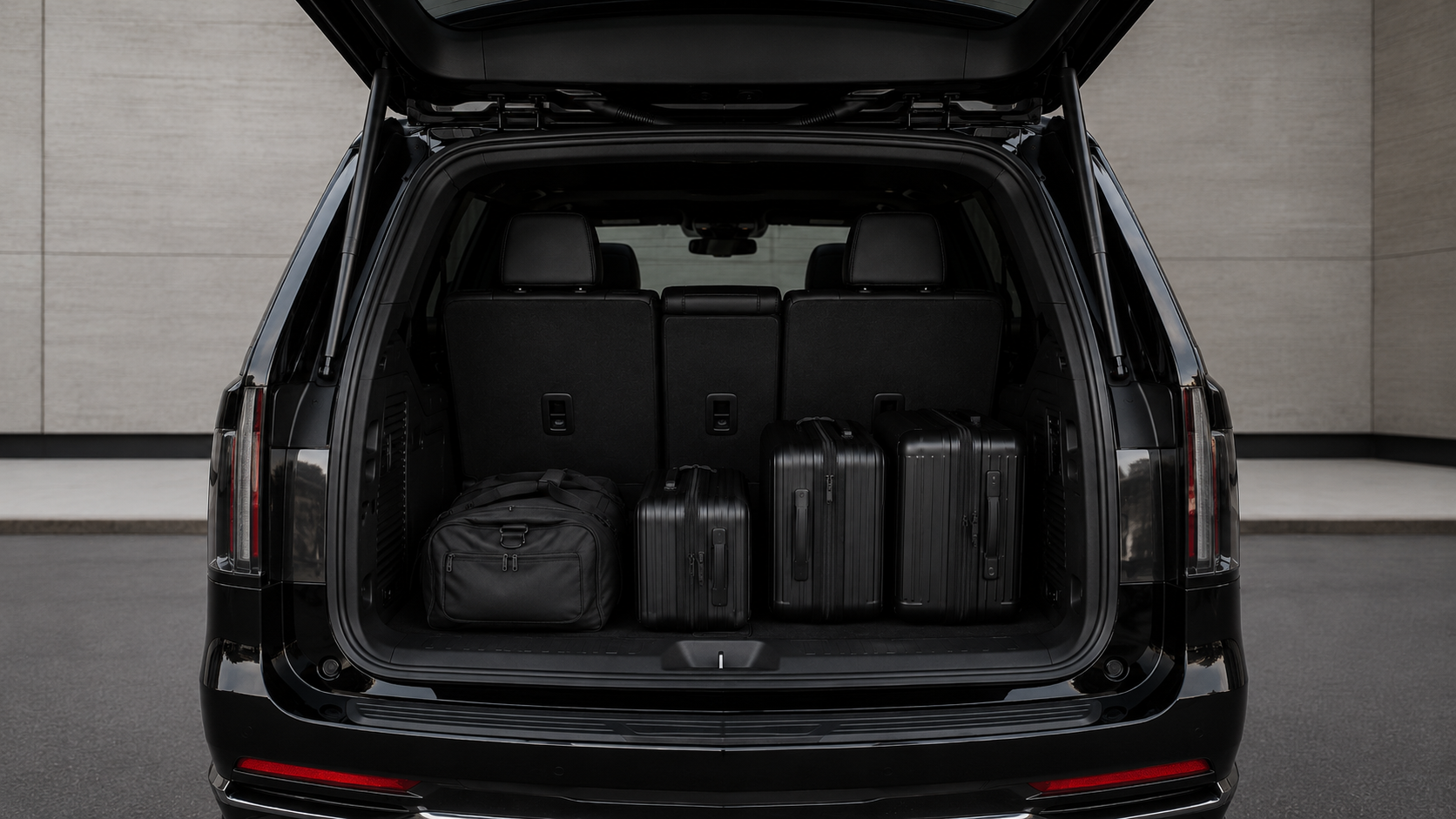 Cargo area of the Cadillac Escalade loaded with luggage, seats up